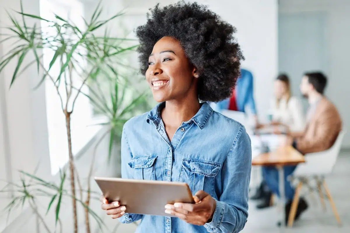 Woman thinking about managing software licenses and reducing her SaaS expenses