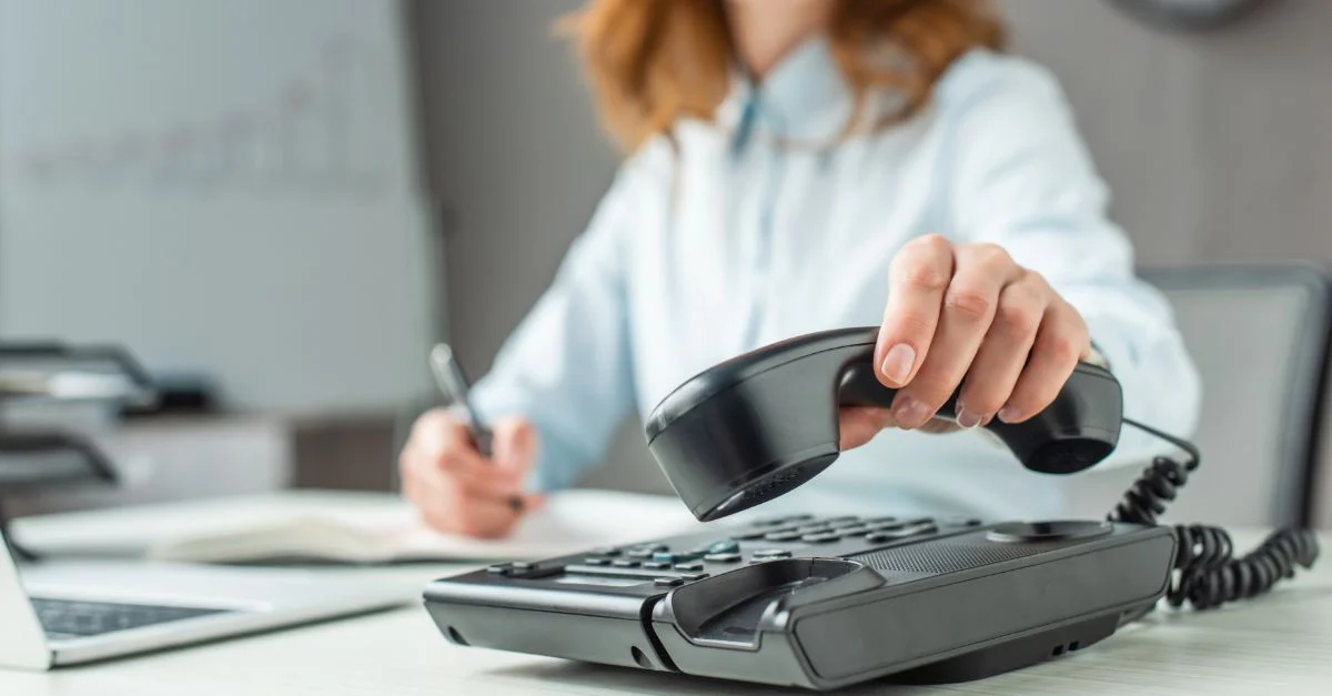 Woman hanging off phone line