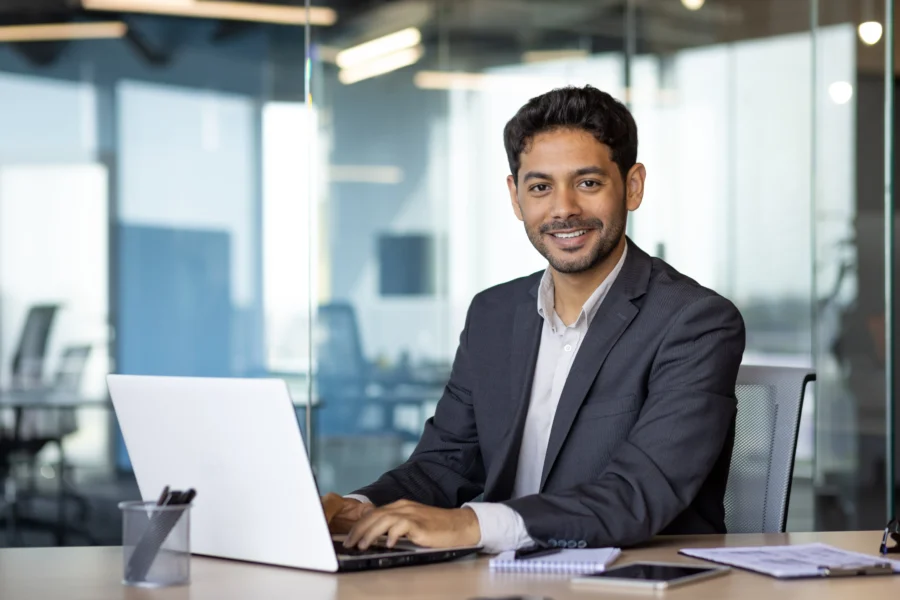 Guy working on procurement's guide to sourcing optimization software