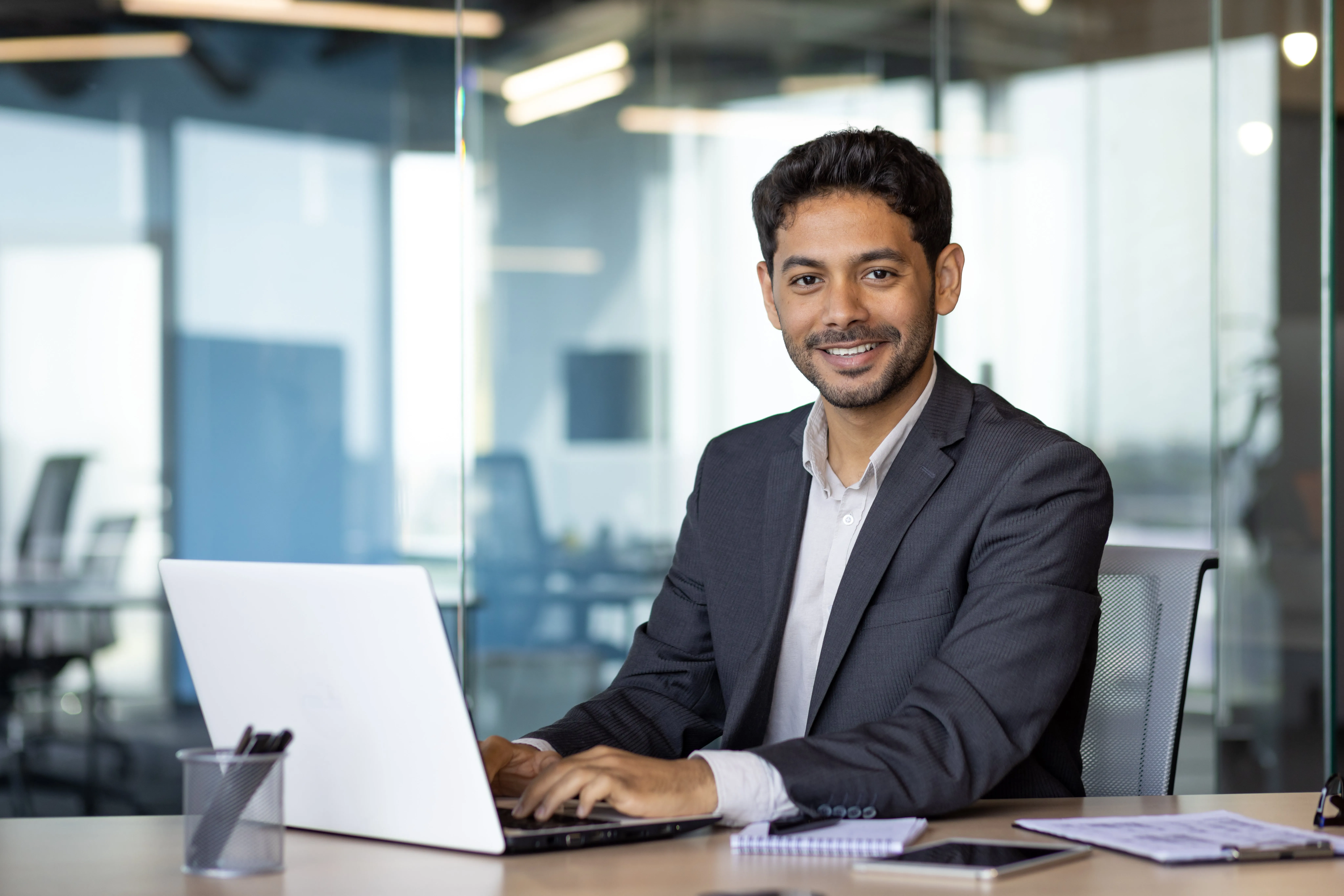 Guy working on procurement's guide to sourcing optimization software