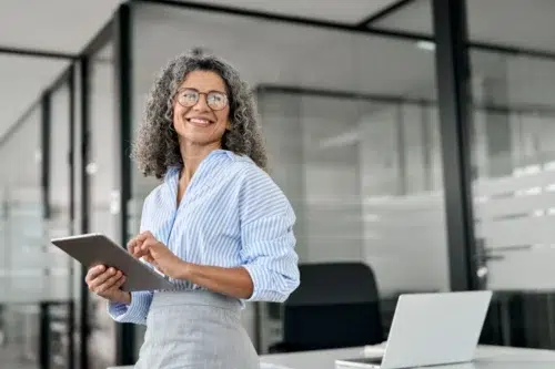 Business woman after optimizing spend with predictive SaaS analytics tool from Calero