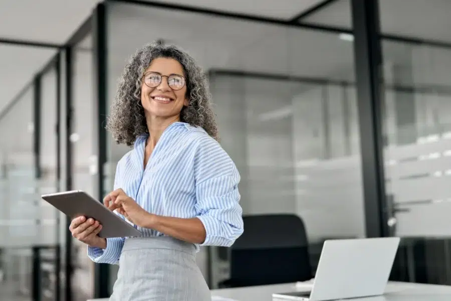 Business woman after optimizing spend with predictive SaaS analytics tool from Calero
