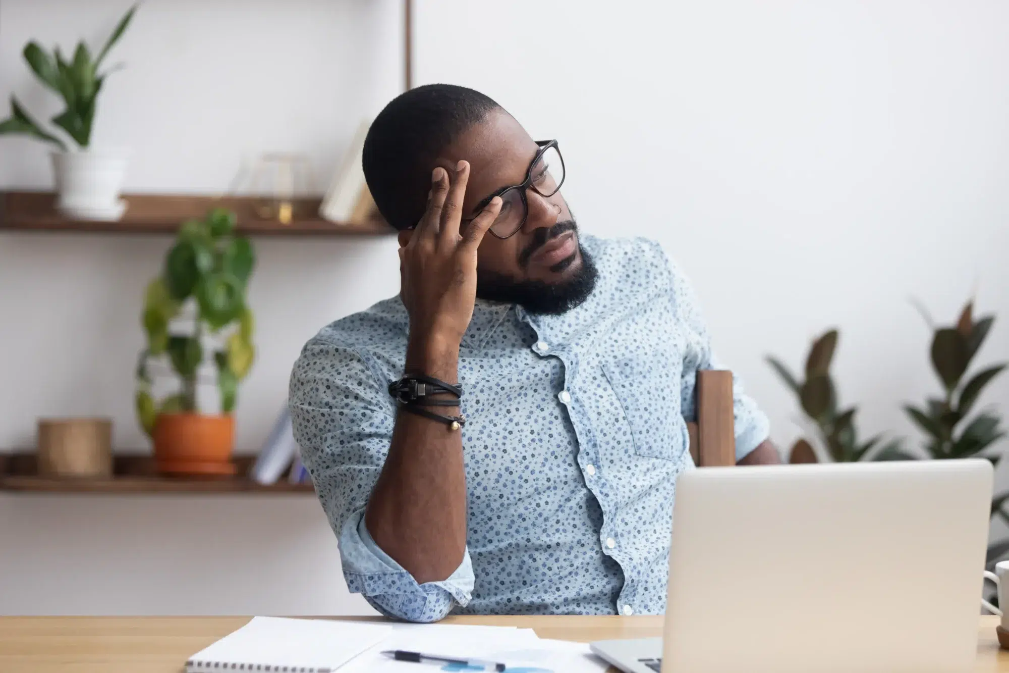 Guy thinking about implementation difficulties