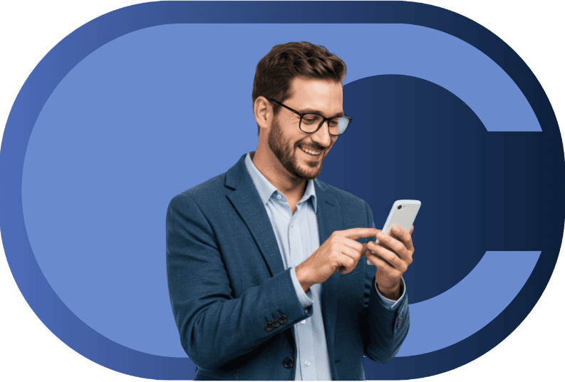 Man smiling and looking at his phone in front of the calero logo